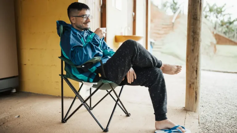 Casual outdoor relaxation with a mug on a sunny day, perfect for leisure and tranquility.